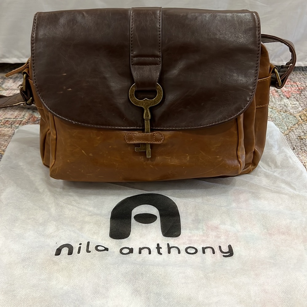 Nila Anthony distressed vegan leather large crossbody with unique key closure